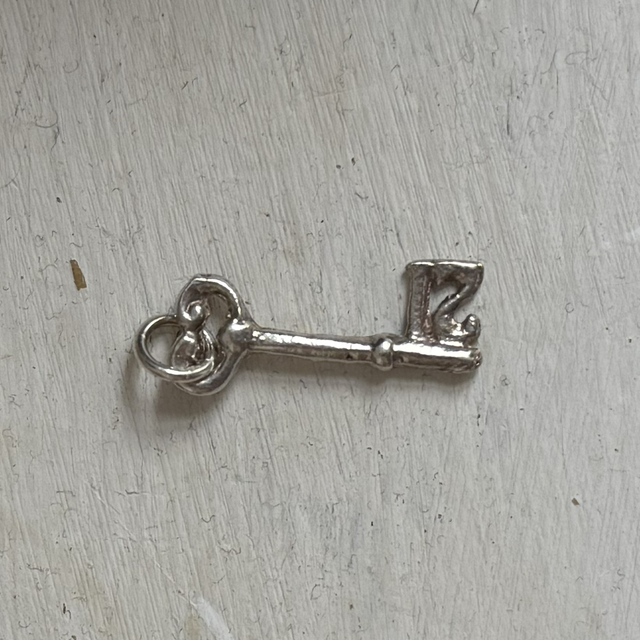Silver key charm 