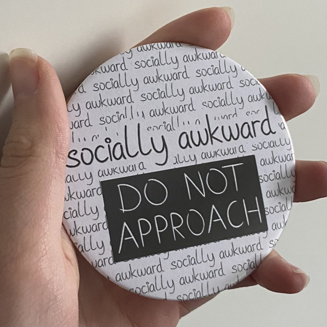 M: socially awkward (button large)