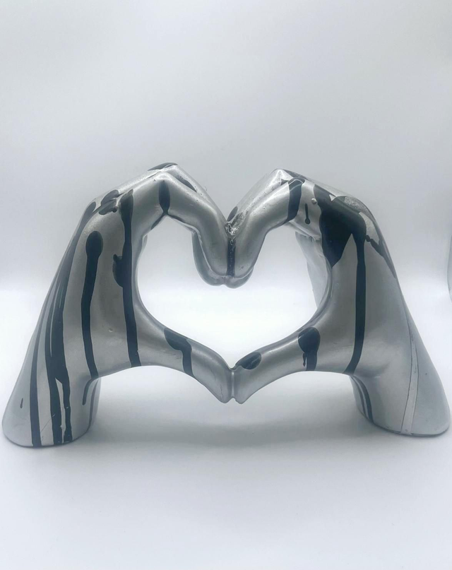 614.Heart hands- ceramic ornament. Hand painted in Chrome and black drip effect.