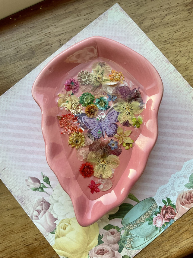 Pink leaf ring trinket tray with pressed flowers.