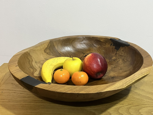 Fruit bowl made from teak tree root.