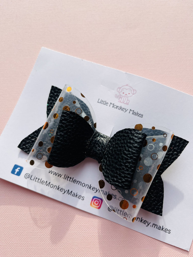 Black leather bow with gold acetate