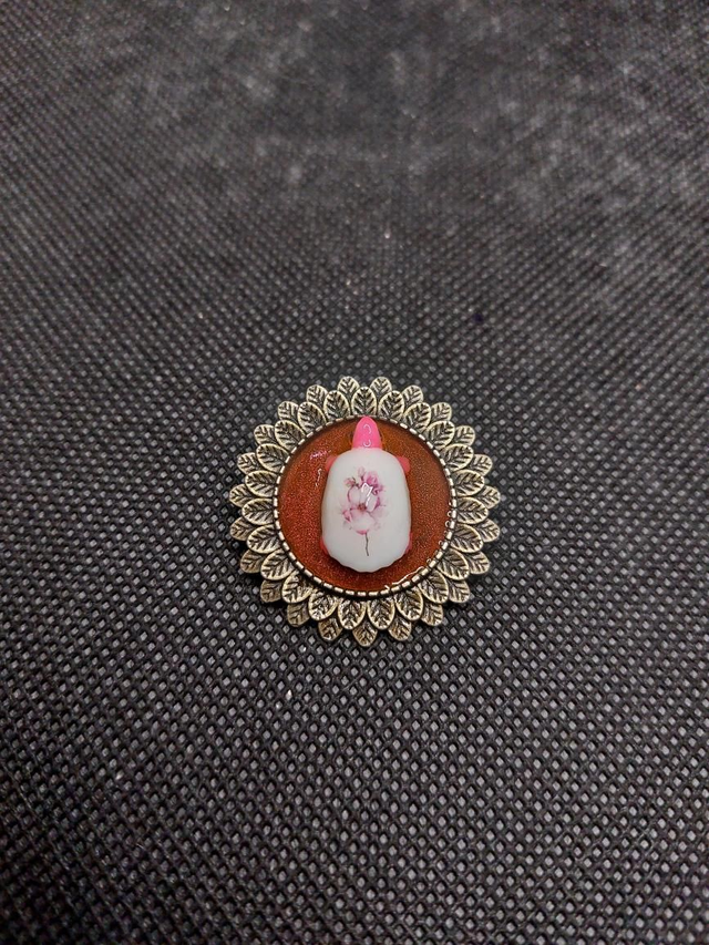 Broche tortue rose