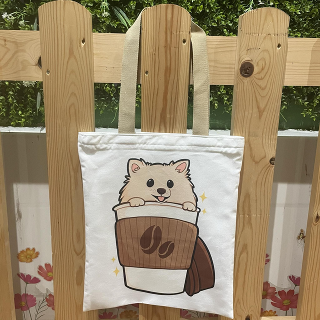 Pomeranian in coffee cup tote bag