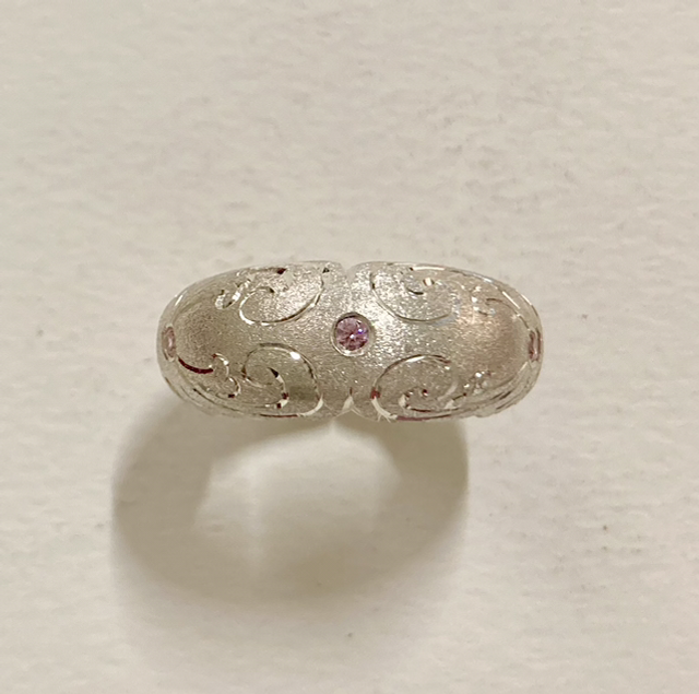 Six section silver domed ring with 6 pink cubic zirconia
