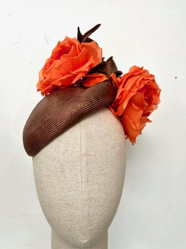 Bitter chocolate paribuntal straw percher trimmed with orange silk roses