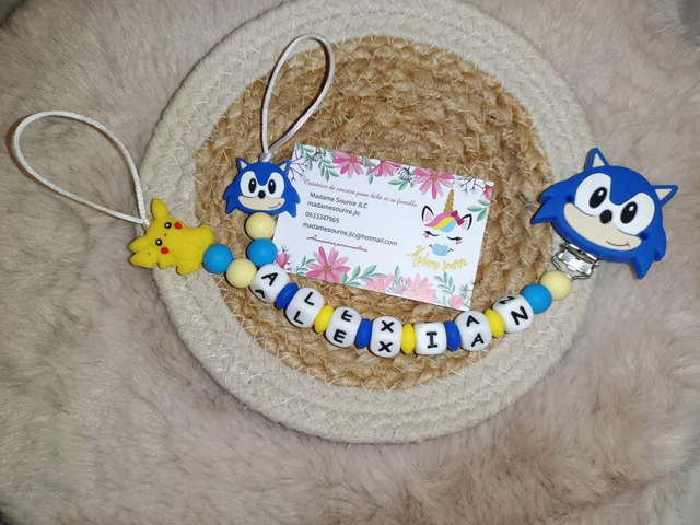 Attache tétine double idole 