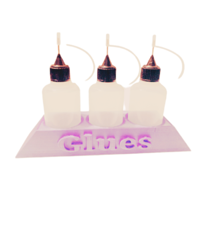 Pink glue holder and glue bottles 