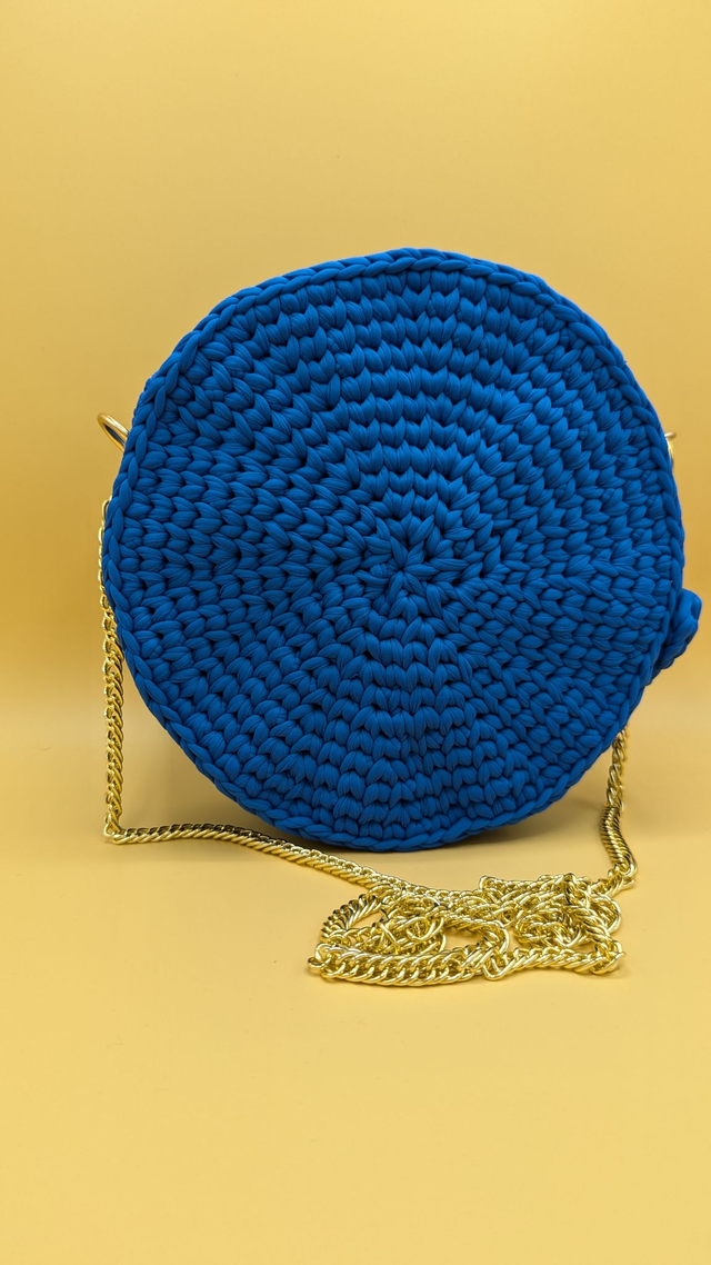 Sac bleu roi doré rond