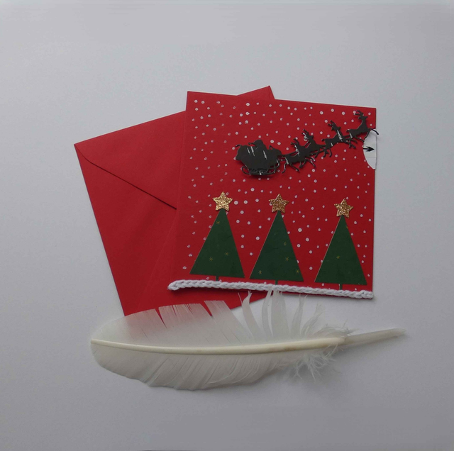 Joli traîneau au-dessus de la forêt (carte à tirette)