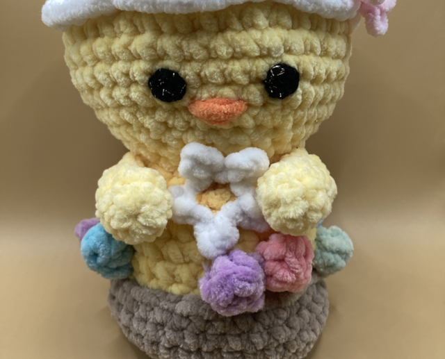 Poussin dans son nid