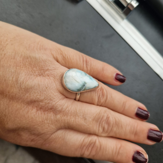 Sterling silver ring set with a larimer stone size O