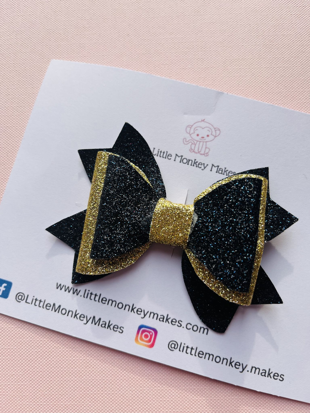 Black and gold glitter bow