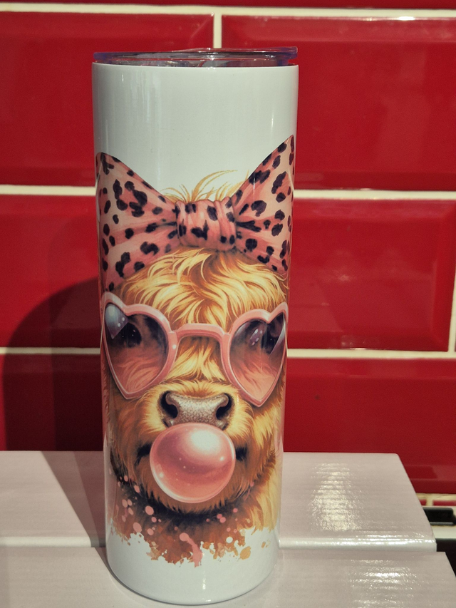 Highland Cow with pink bubblegum