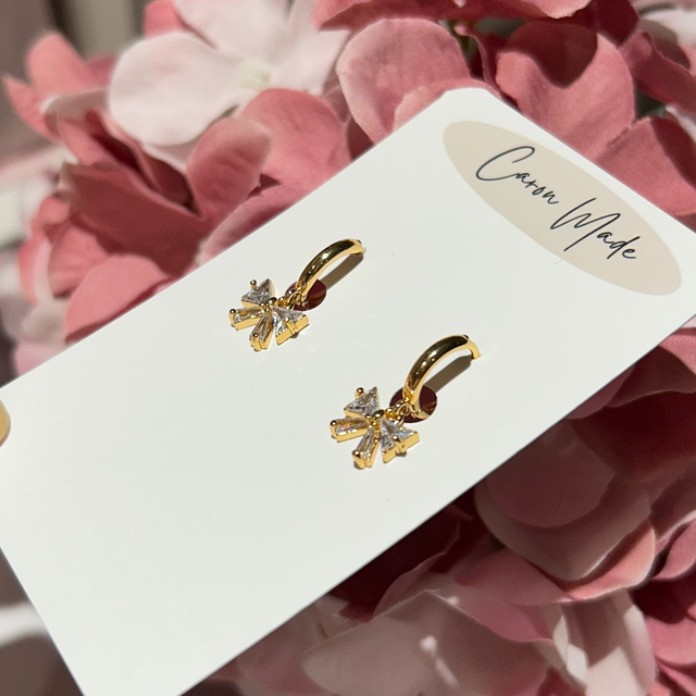 Bow CZ earrings on small huggie hoop