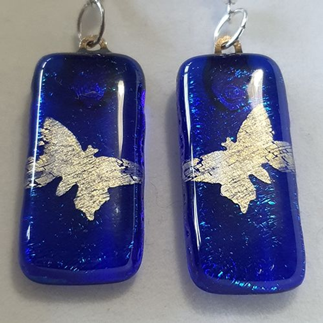 blue fused glass dangly earrings with silver butterfly design e56