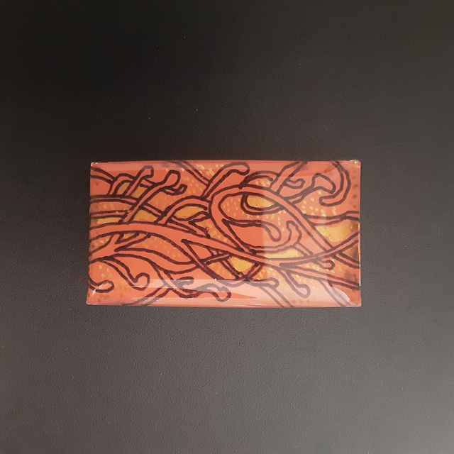 Broche rectangle collection médiéval fond orange et décor arabesque noir et doré