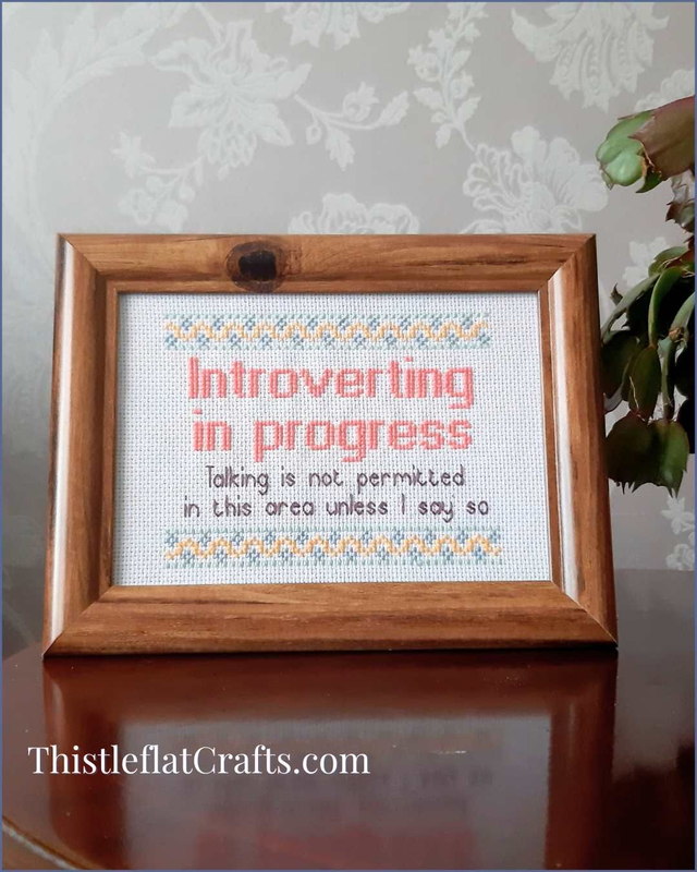 Introverting in Progress, completed cross stitch decor
