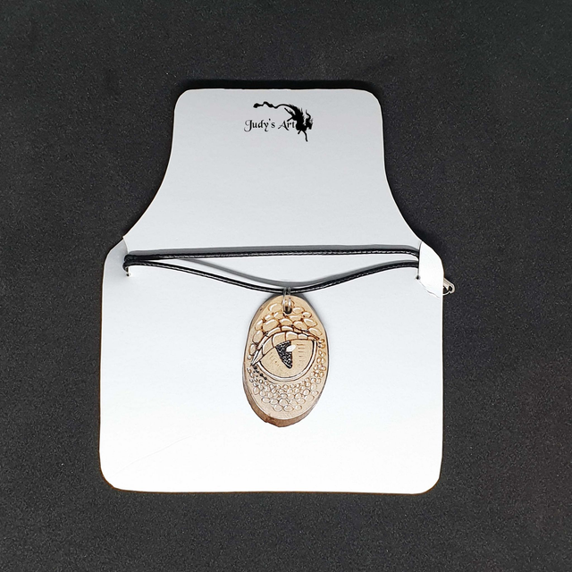 Pendentif pyrogravure "Oeil de Dragon"