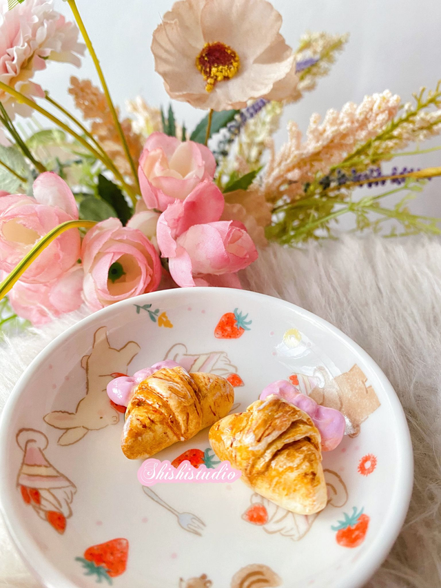 Miniature croissant chopsticks/brush rest