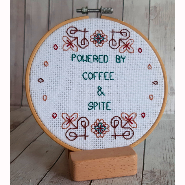 Powered by coffee and spite, completed cross stitch home decor