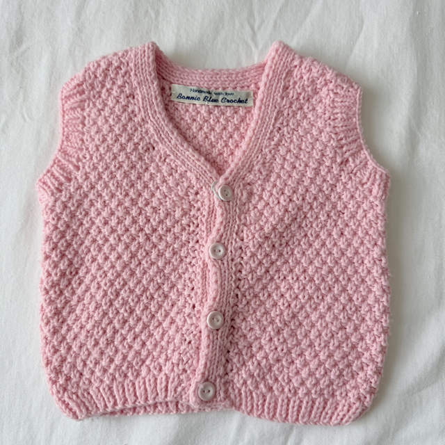 Pink knitted waistcoat