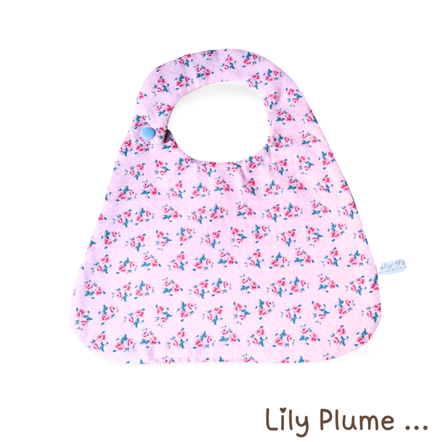 Bavoir pression rose à fleurs