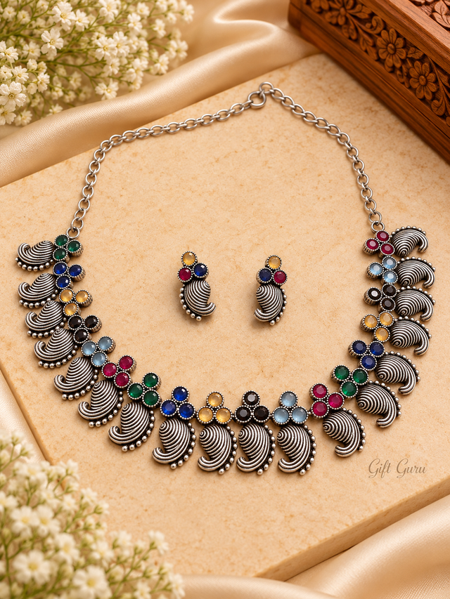 Antique oxidized silver jewelry set traditional paisley/mango motif adorned with vibrant, multi-colored cabochon stones and matching stud earrings