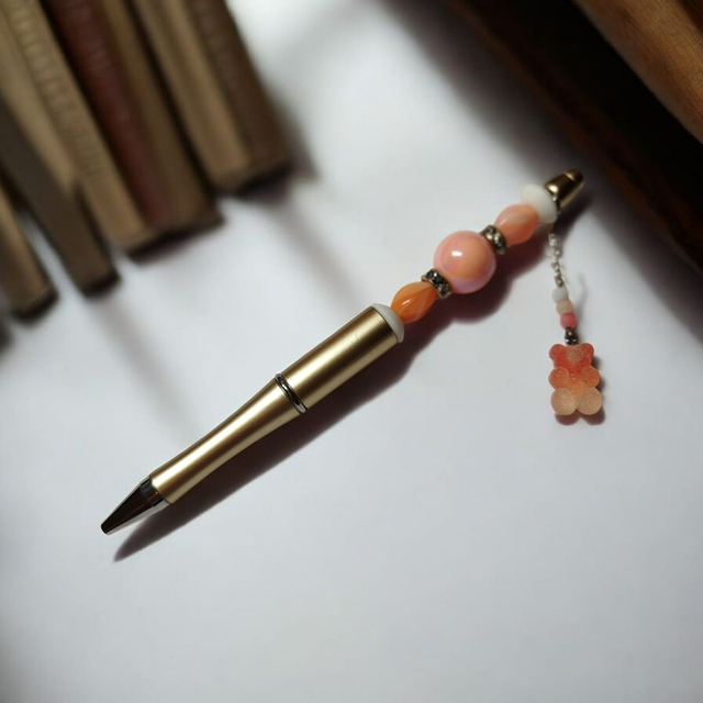 Stylo perles pêche et or