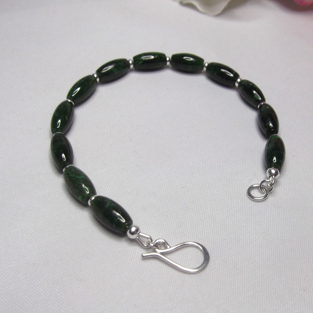Green Jade gemstone bead bracelet with small recycled silver spacer beads