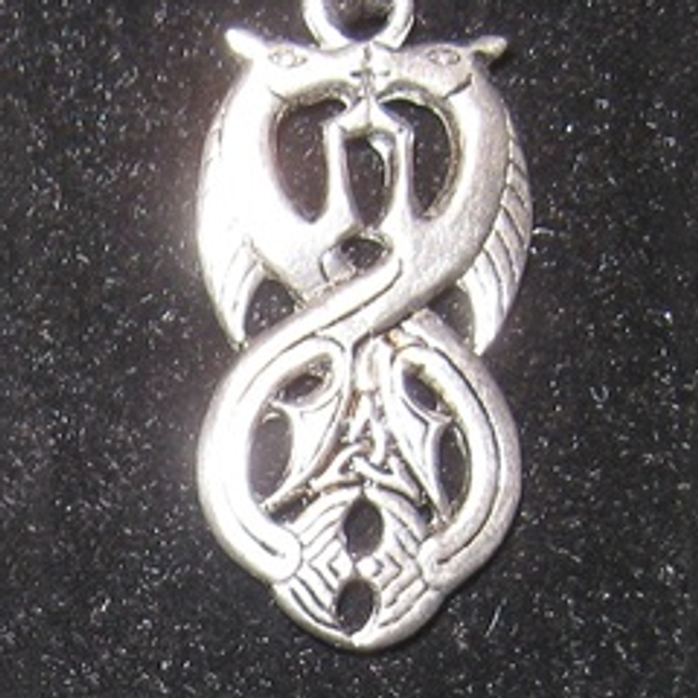 Pewter pendant (facing beasts)