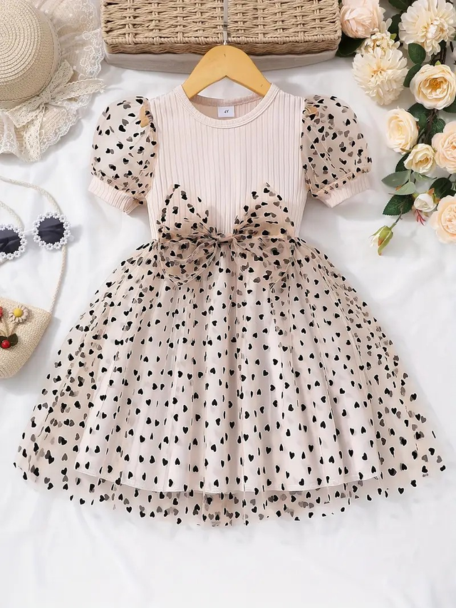 A knitted top with polka dot mesh skirt