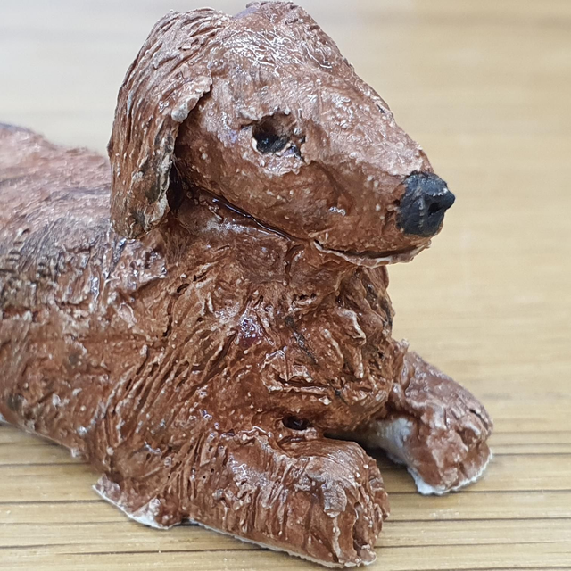 Long haired Dachshund (sausage dog) sculpture