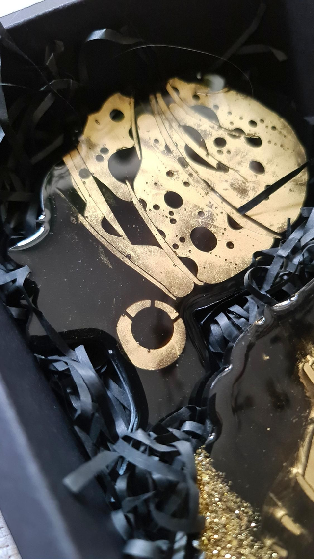 Set of 2 black and gold coasters