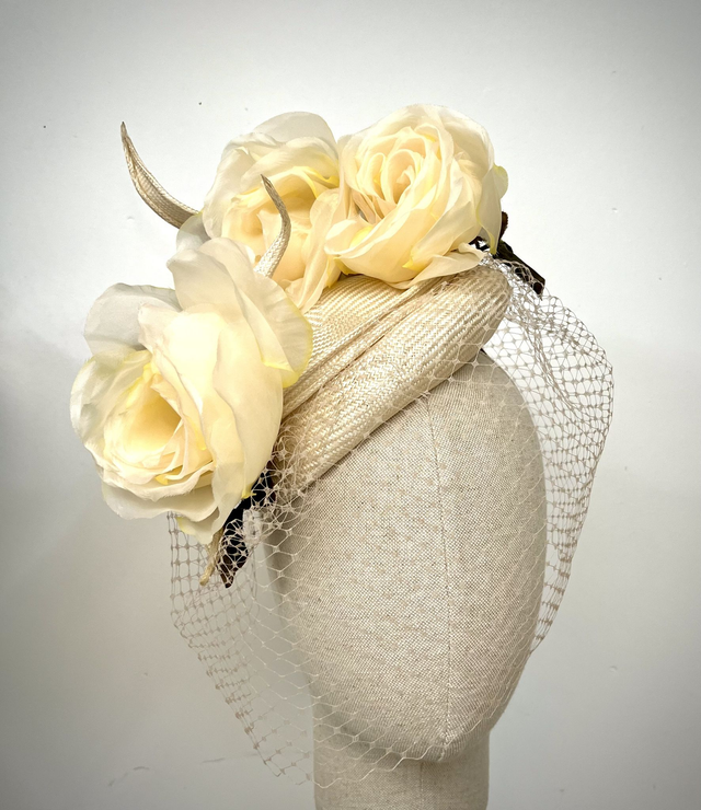 Ivory parisisal straw asymmetric percher trimmed with 3 yellow toned silk roses and face veil