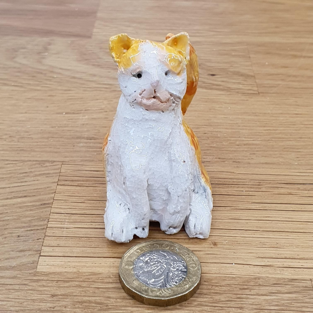 Ginger and white cat sculpture