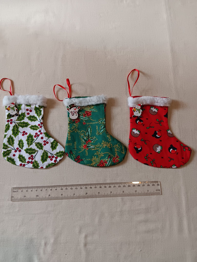One Seasonal Fabric Stocking Decoration with hanging loop and decorative wooden button, Fully lined