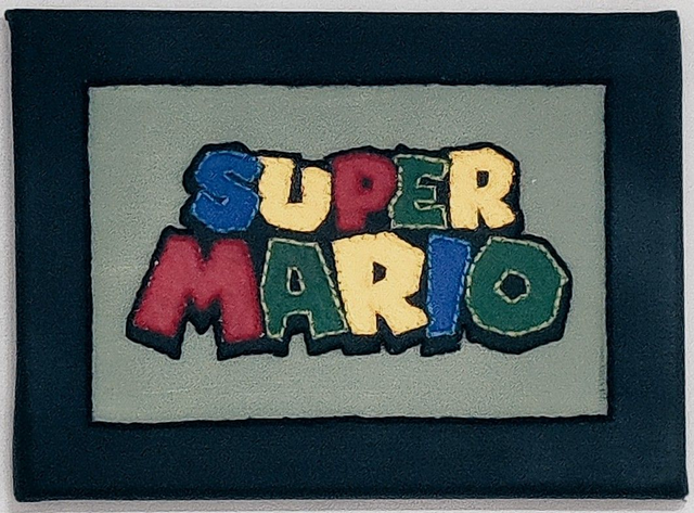 Toile brodée Super Mario
