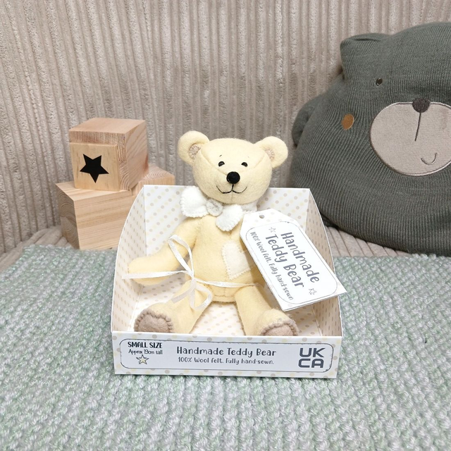 Pastel yellow bear. *No name*. Small size, handmade teddy bear. UKCA. Tray base packaging. Standard Wool Felt. Cream. Beige.