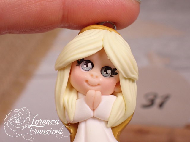 Angioletto custode tascabile n.
31 Portachiavi o charm, artigianale, pezzo unico. Modellato a mano argilla polimerica, made in Italy.
