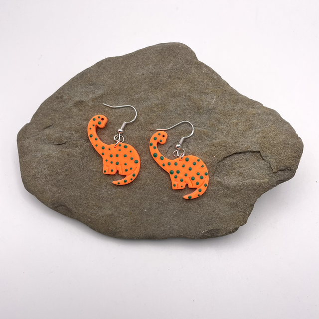 Spotty orange Brachiosaurus earrings 