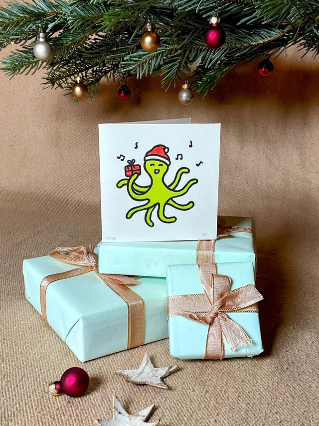 Weihnachtskarte "Octi mit Geschenk"