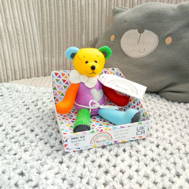 Rainbow. Small size, handmade teddy bear. UKCA. Tray base packaging. Standard Wool Felt. Yellow. Blue. Green. Purple. White. Grey. Orange. Red.