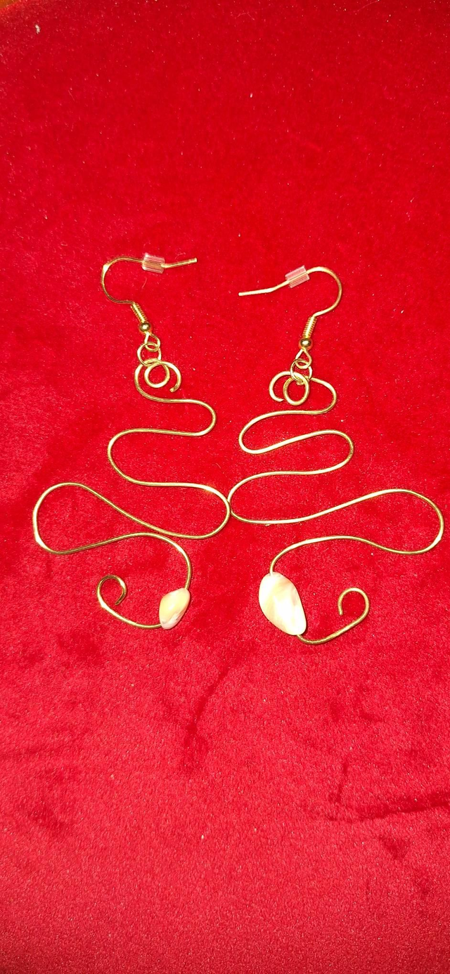 A lovers journey in gold with trochus shell, two earrings