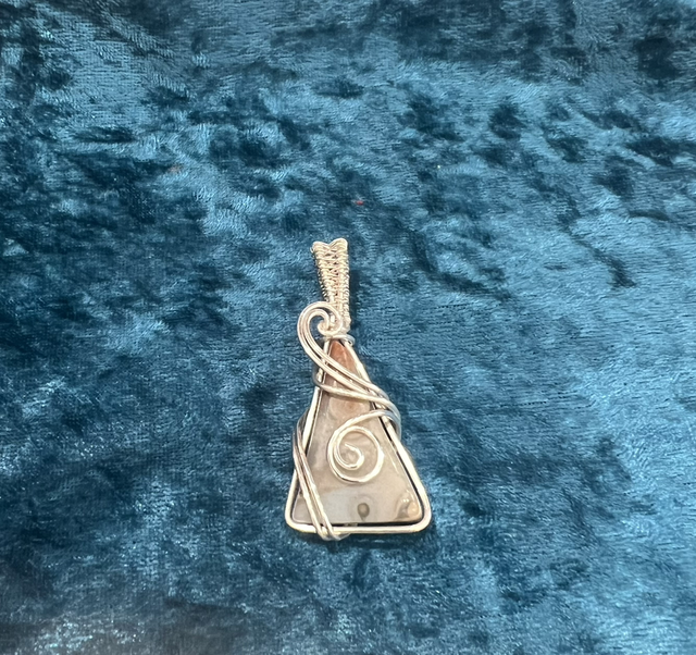 Wire wrapped crazy lace agate pendent