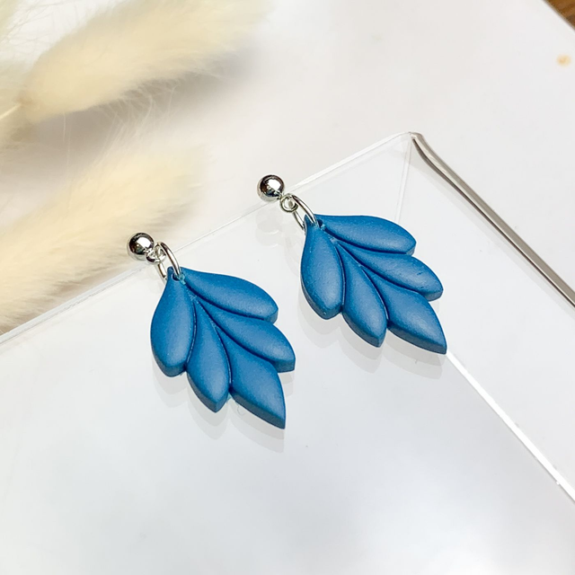 Small teal blue floral shape earrings