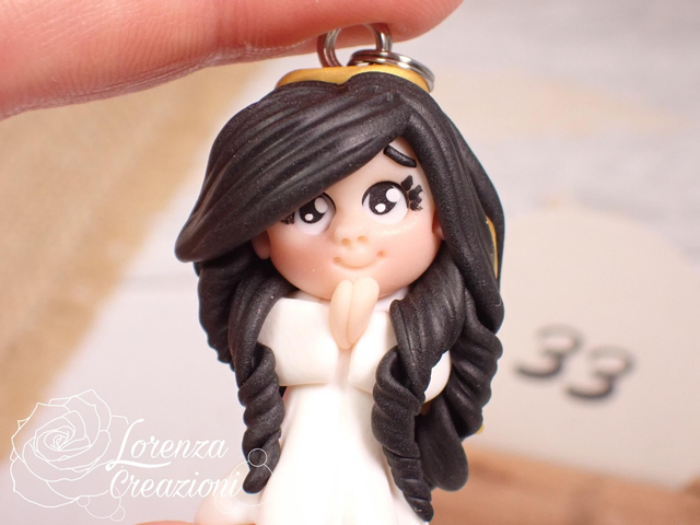 Angioletto custode tascabile n.
33 Portachiavi o charm, artigianale, pezzo unico. Modellato a mano argilla polimerica, made in Italy.
