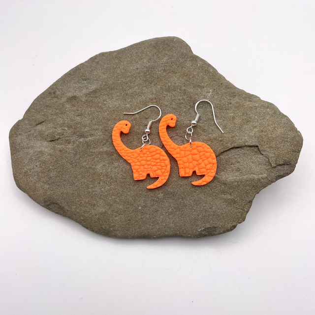 Orange brachiosaurus earrings 