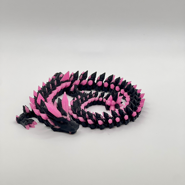 Pink and black small dragon