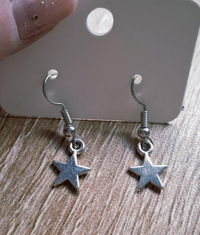 Silver tone star drop earrings